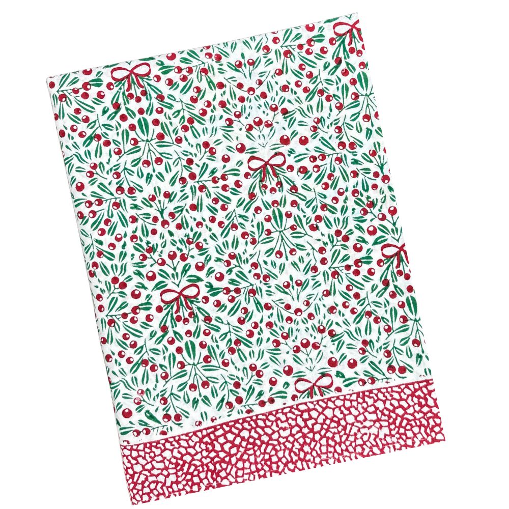 Christmas-themed tablecloth with holly berries, red bows, and a white background