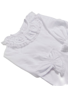 White blouse with ruffled details on a white background