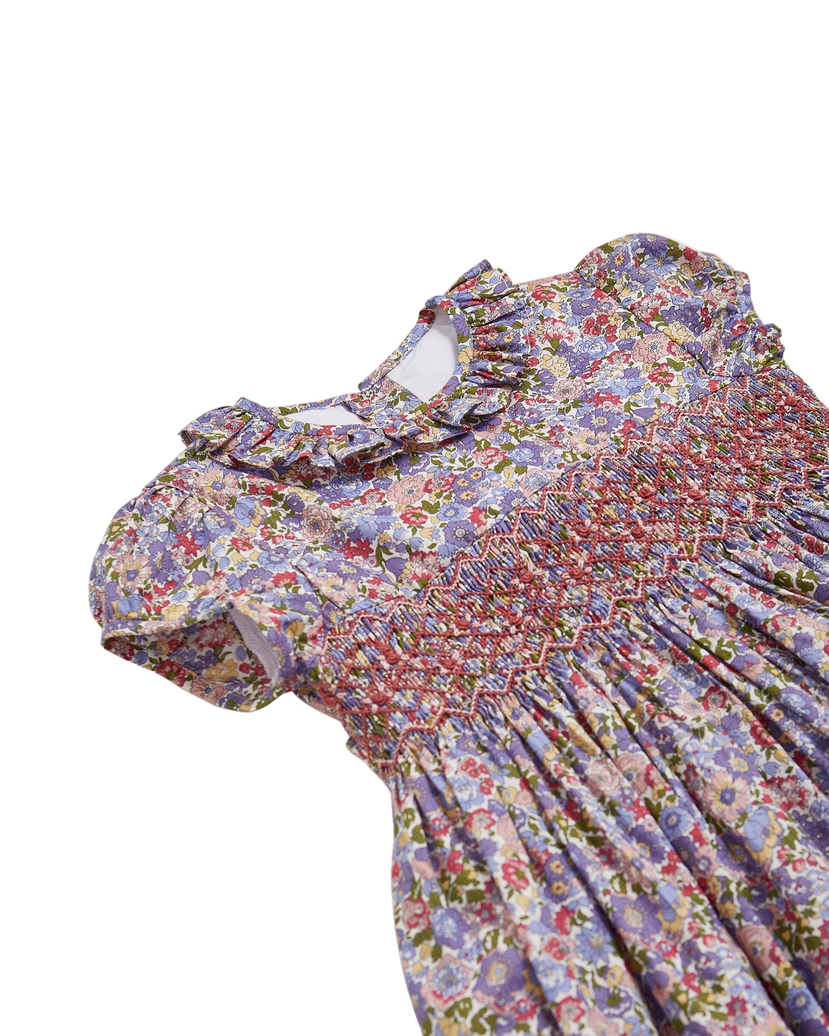 Floral dress with a ruffled neckline on a white background