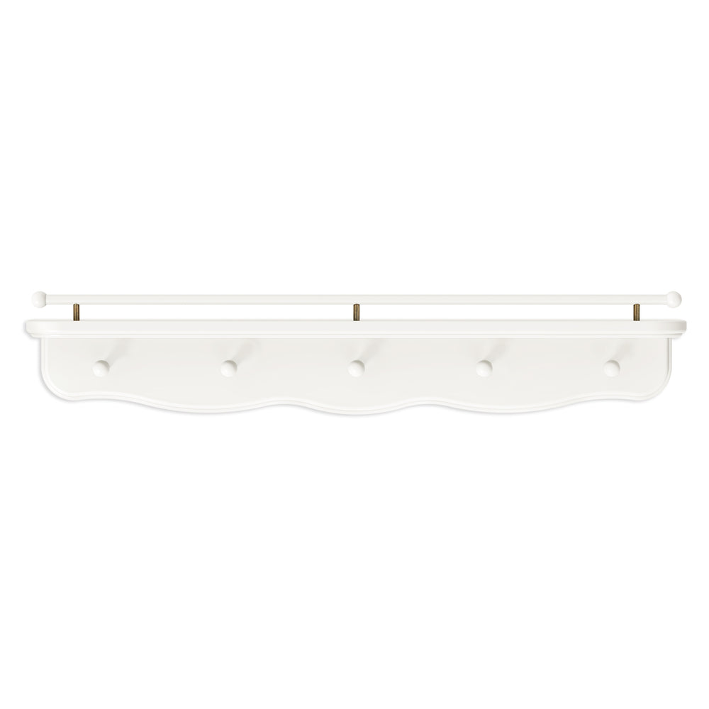 Front view of Liberty 31 inch warm white wall shelf with hooks, scalloped apron, and spindle rail