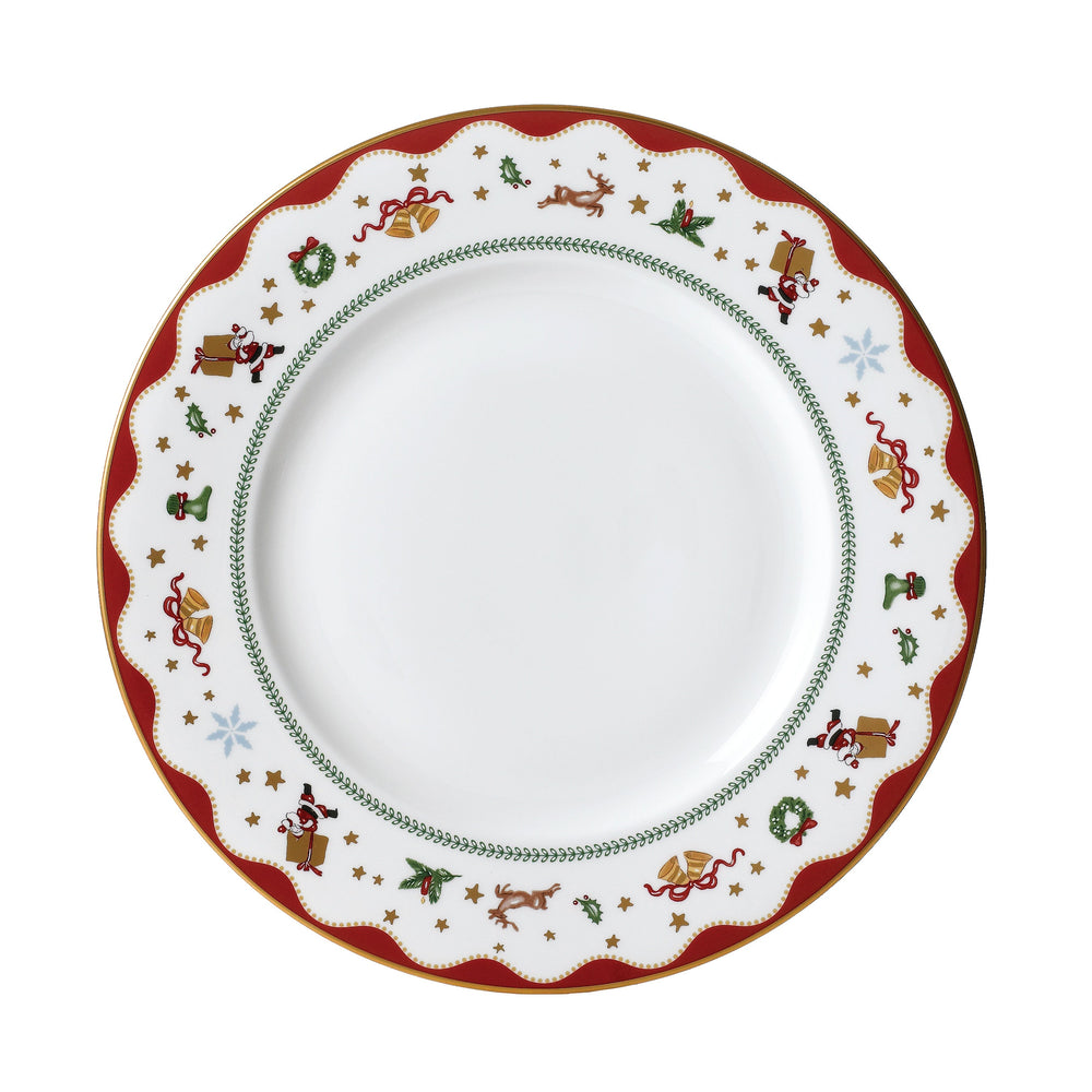 Overhead view of My Noel dinner plate with red scalloped holiday border, holly, wreaths, bells, reindeer and 24K gold rim