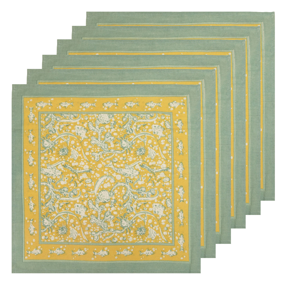 Overhead view of La Mer Napkins Aqua and Citrine set of 6 showcasing fish and floral print on white background