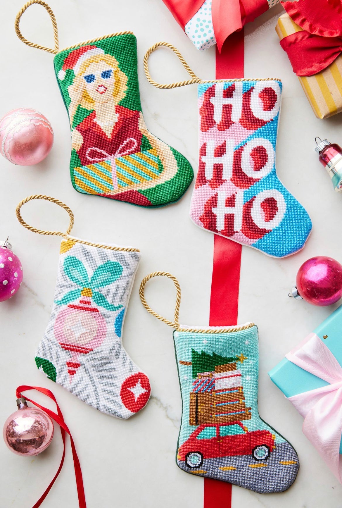 Festive display featuring HO HO HO Bauble Stockings, together with other holiday-themed stockings
