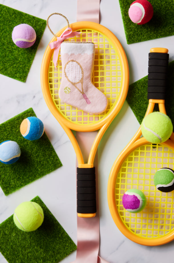 Tennis-themed Bauble Stockings styled with colorful tennis balls, rackets, and festive green accents