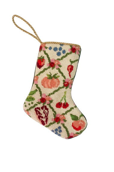 Needlepoint stocking featuring a festive arrangement of vegetables, fruits, and florals.