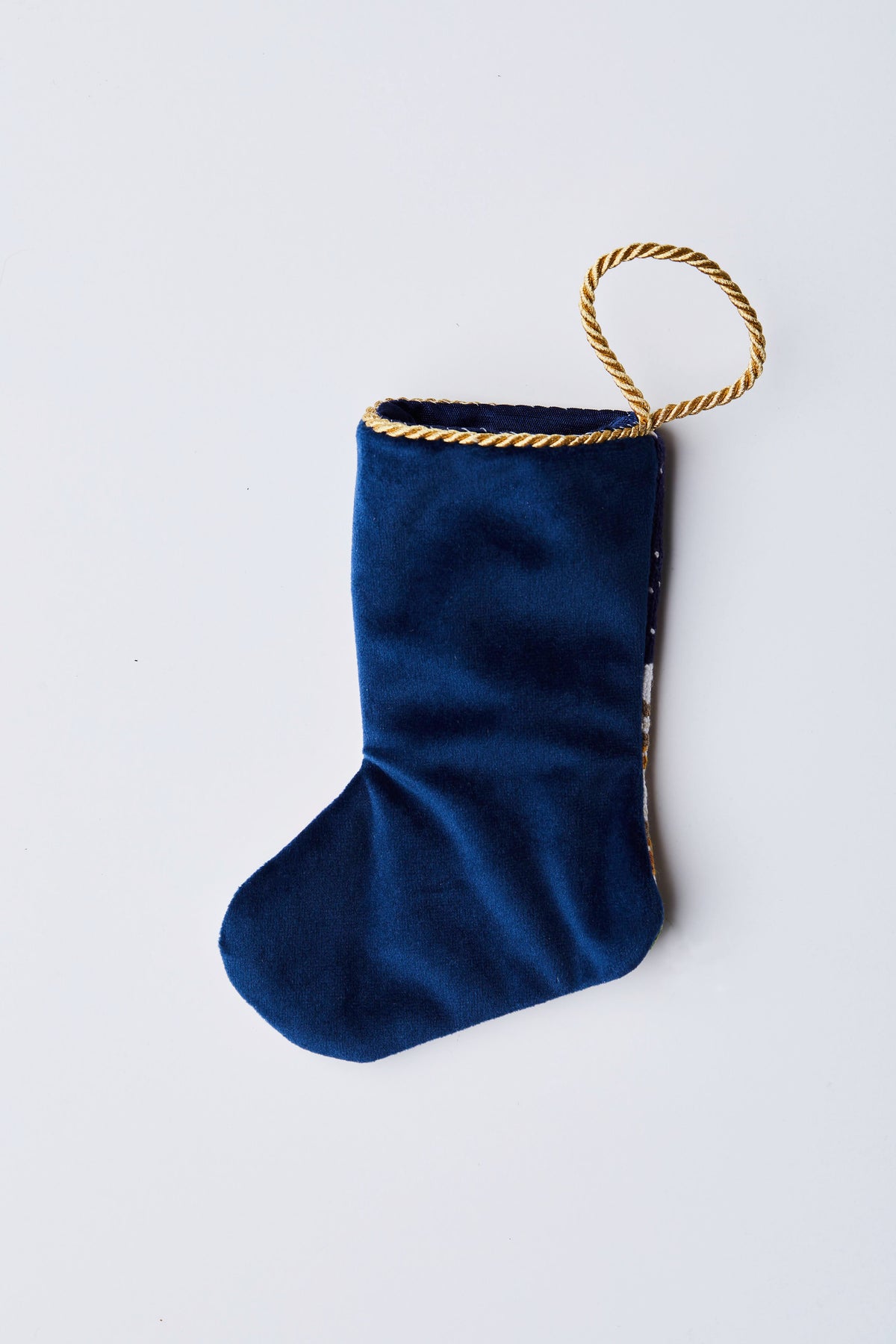 Back view of Home for the Holidays needlepoint stocking with solid navy blue velvet backing