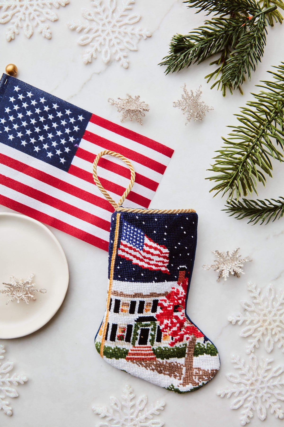 Bauble Stockings styled with American flag, pine branches, and winter decor