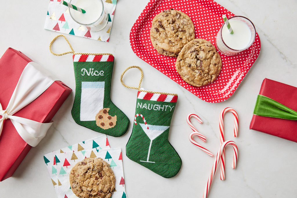 Hand-stitched Nice and Naughty Bauble Stockings on festive holiday background