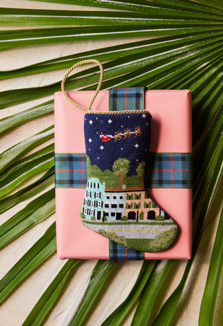 Bauble Stockings styled on pink gift box with green palm leaves