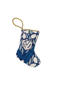 Needlepoint stocking featuring a white tulip with blue blossoms on a floral background