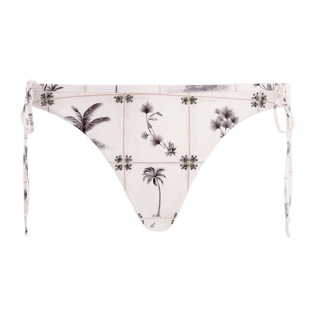 Front view of Ocaso Arena Bikini Bottom showcasing hand embroidery, side ties, and hip bows on white background
