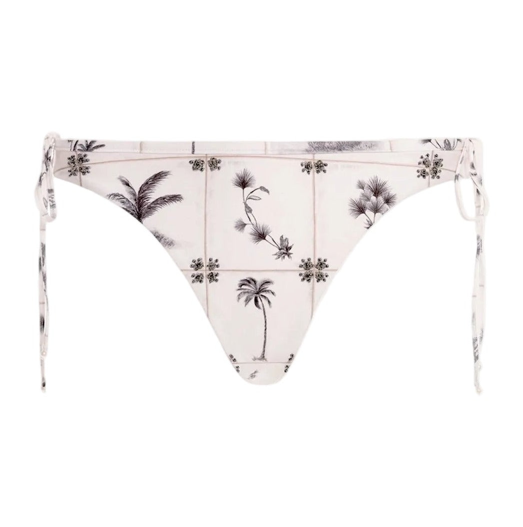 Front view of Ocaso Arena Bikini Bottom showcasing hand embroidery, side ties, and hip bows on white background