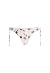 Front view of Ocaso Arena Bikini Bottom showcasing adjustable side ties and hand-embroidered botanical details on a white background