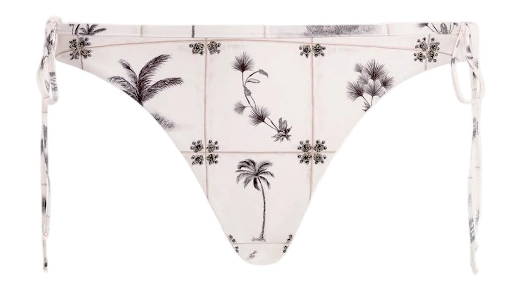 Front view of Ocaso Arena Bikini Bottom showcasing adjustable side ties, hip bows, and hand embroidery on white background
