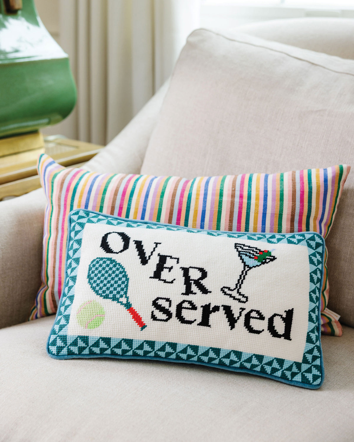 Overserved Needlepoint Pillow - styled on sofa