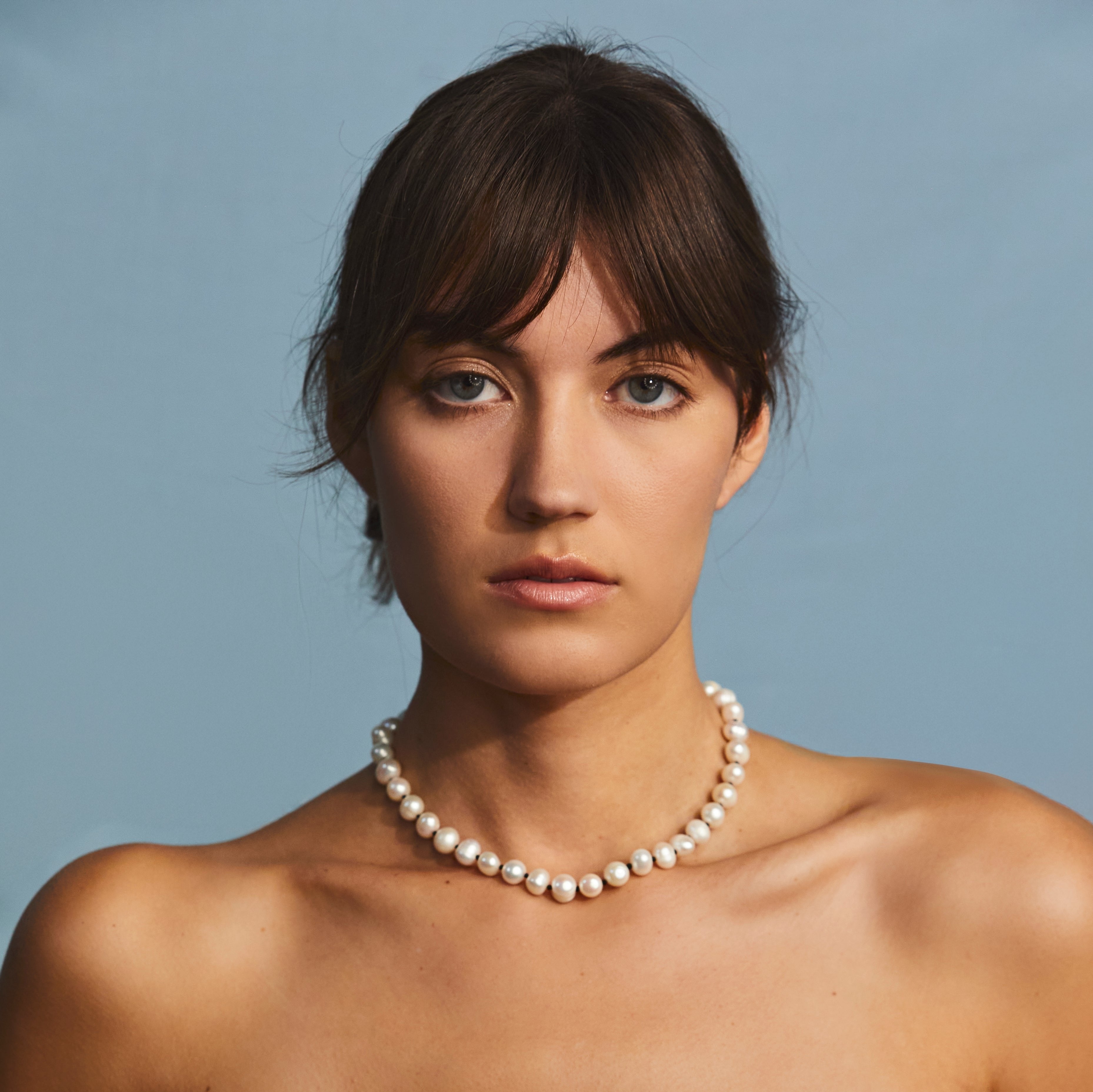 pearl necklace on model 