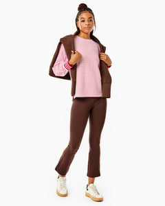 Model is wearing the Penny Pullover in Super White/ Cherry Stripes with the University Flare Pants in Chocolate