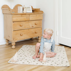 Peter Rabbitª@lifestyle image of a little boy playing on a Peter Rabbitª mat