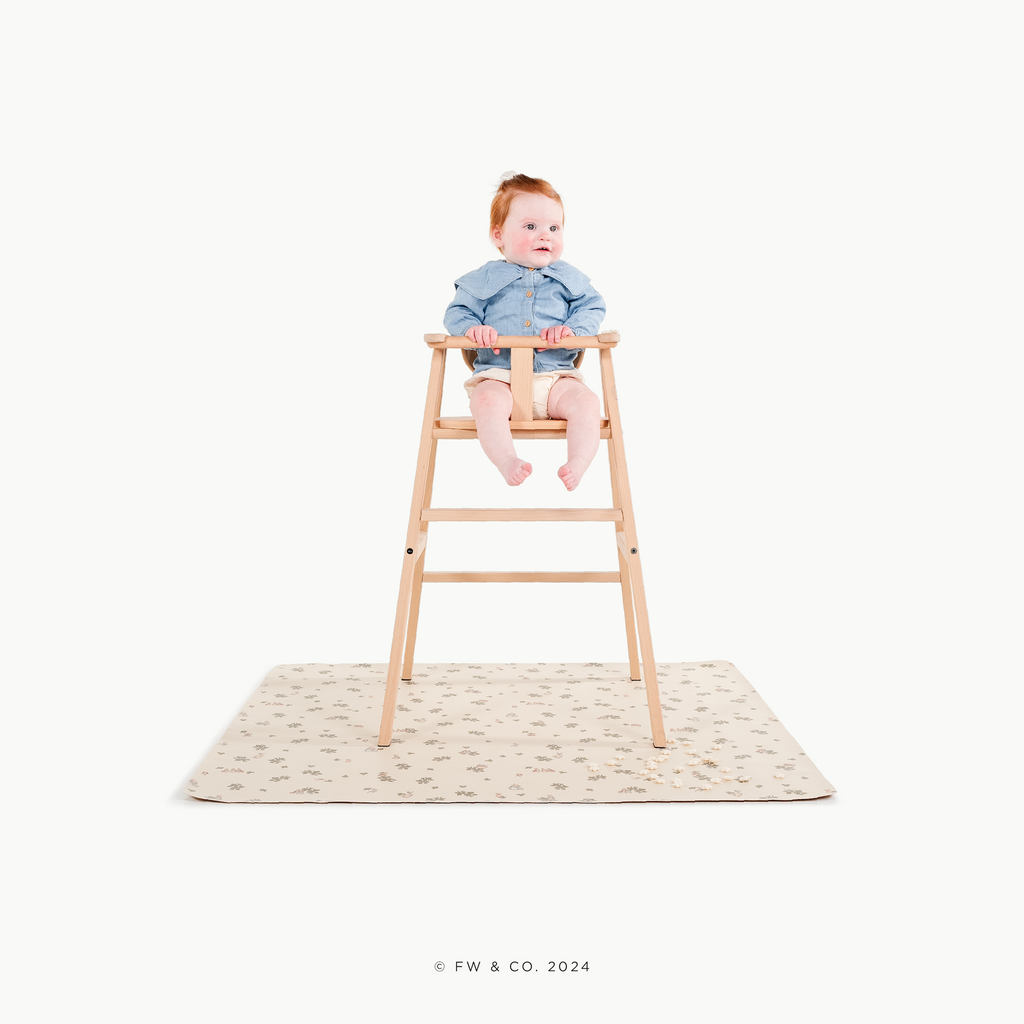 Peter Rabbitª@little girl in a high chair on a mat