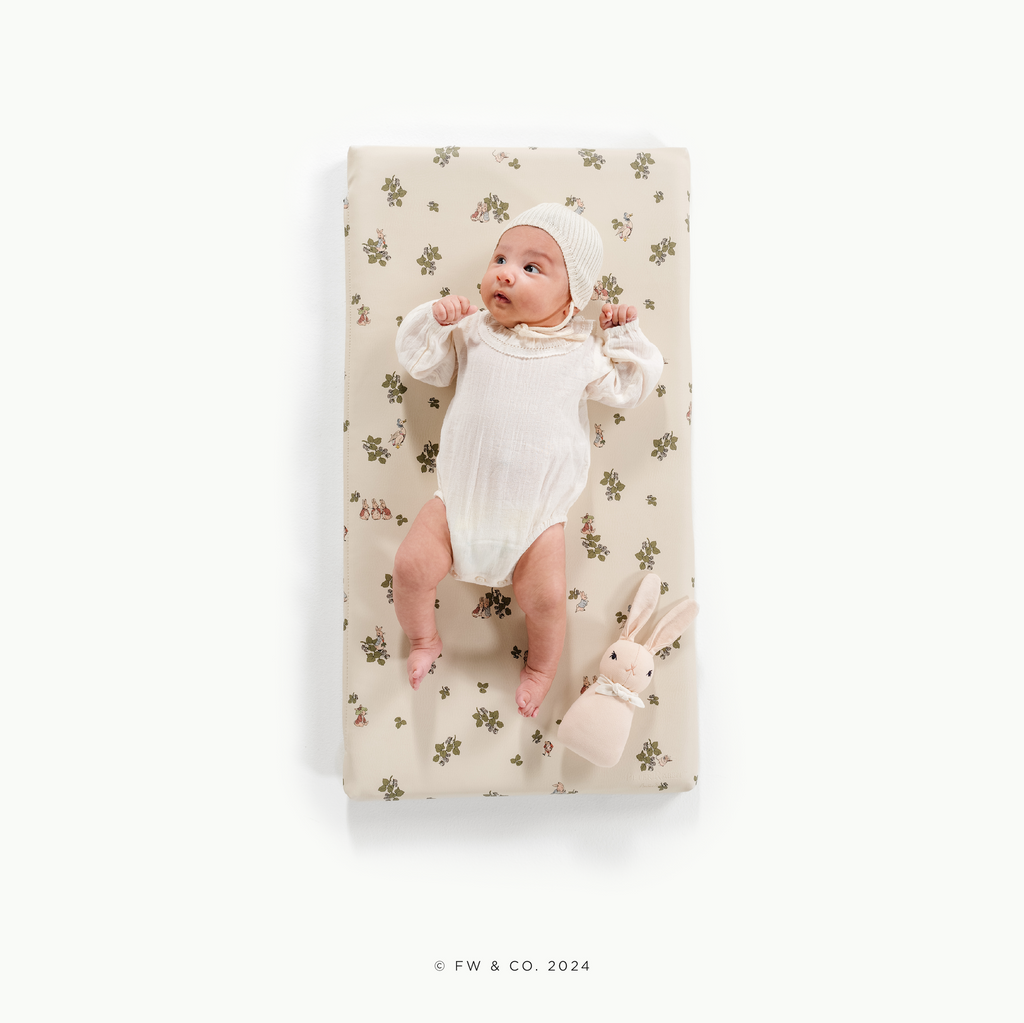 Peter Rabbitª (on sale)@overhead of baby on padded micro+ mat