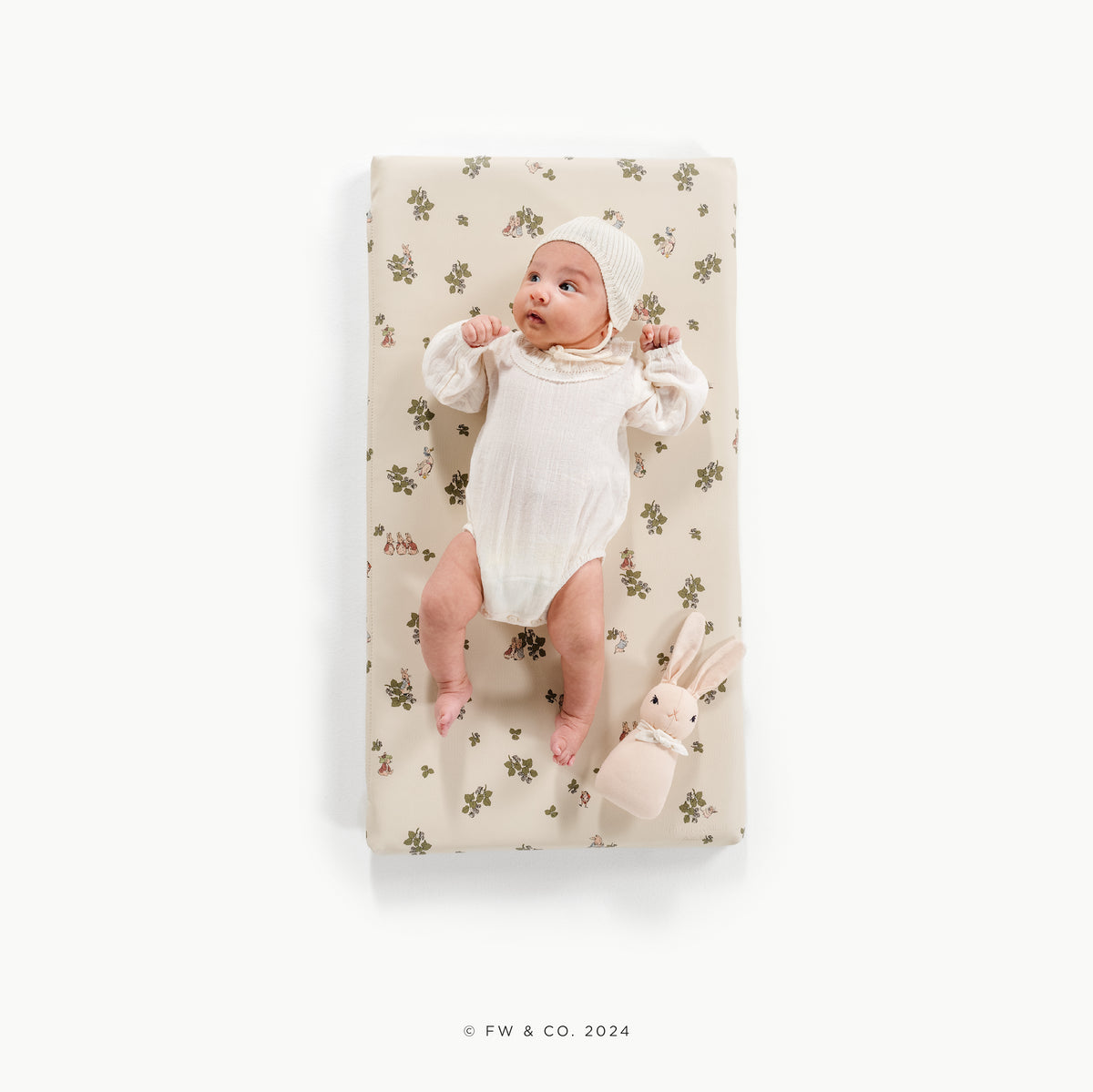 Peter Rabbitª (on sale)@overhead of baby on padded micro+ mat
