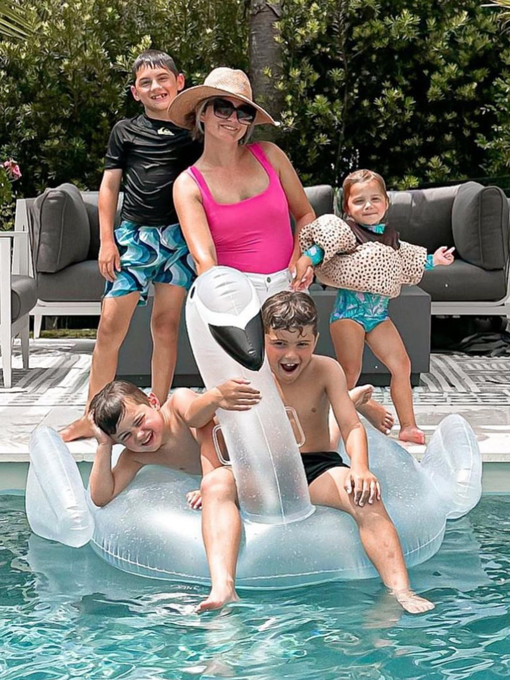 pink dreamsculpt square neck tank one piece swimsuit with tummy control fit on model with family poolside