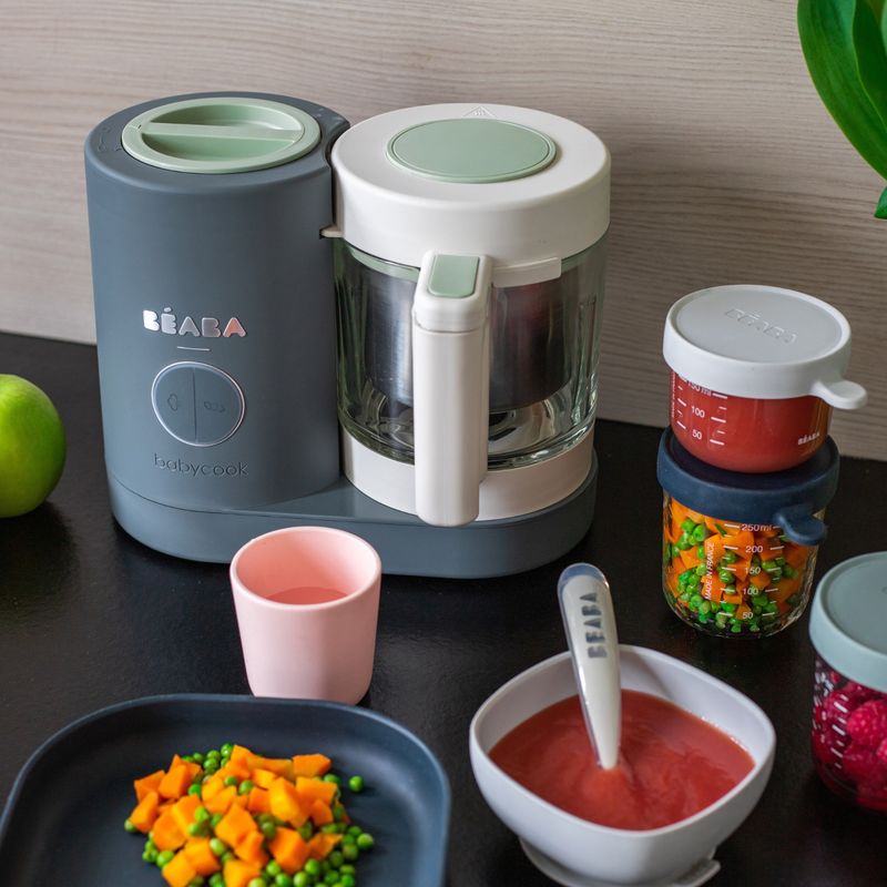 Front view of Babycook Neo in Mineral showcasing its glass bowl and stainless steel steam basket on a tabletop