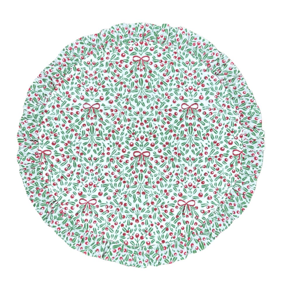 Round quilted placemat with Christmas-themed pattern on a white background