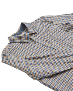 Folded checkered shirt with blue and brown pattern on a white background