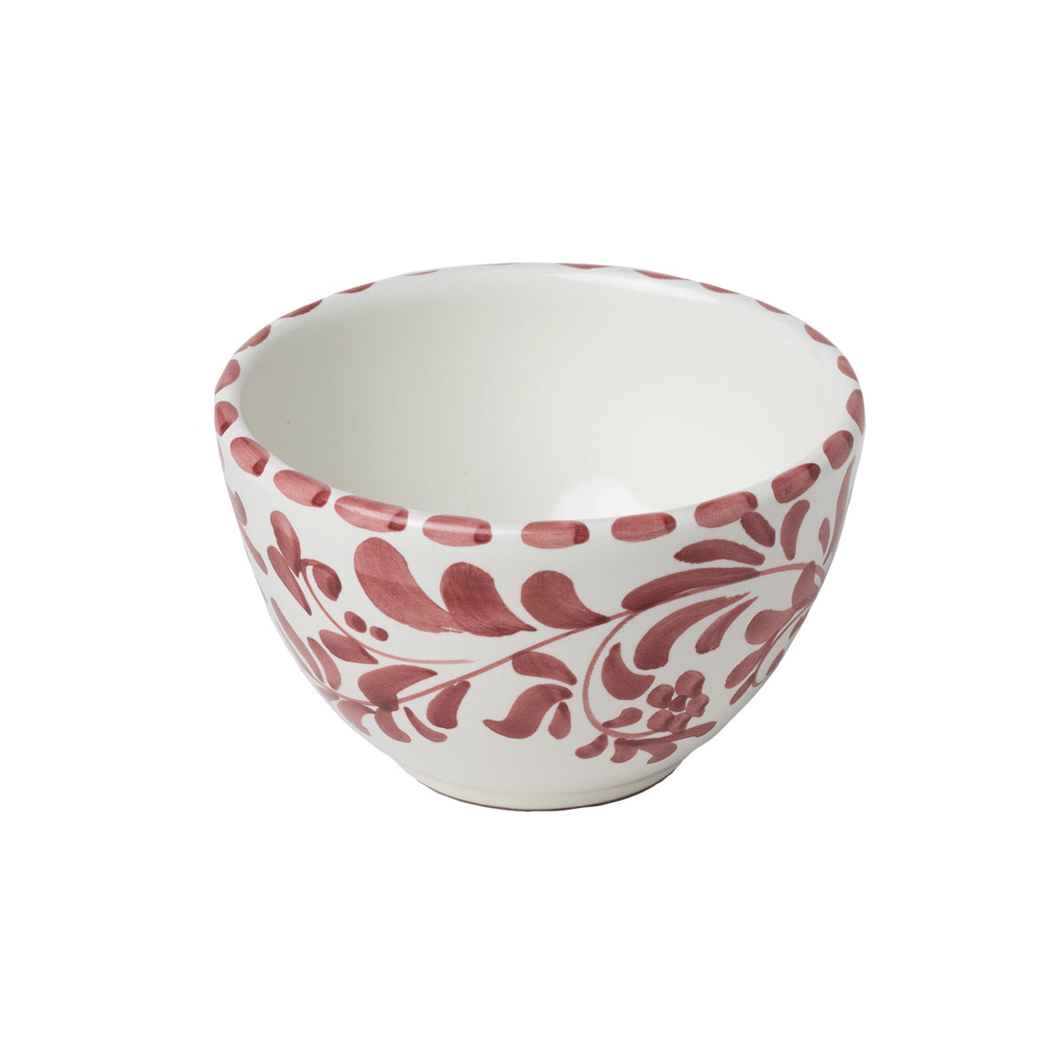 Angled view of Cereal and Dessert Bowl in Vinto Tinto showcasing red leafy impressions on white ceramic with a white background