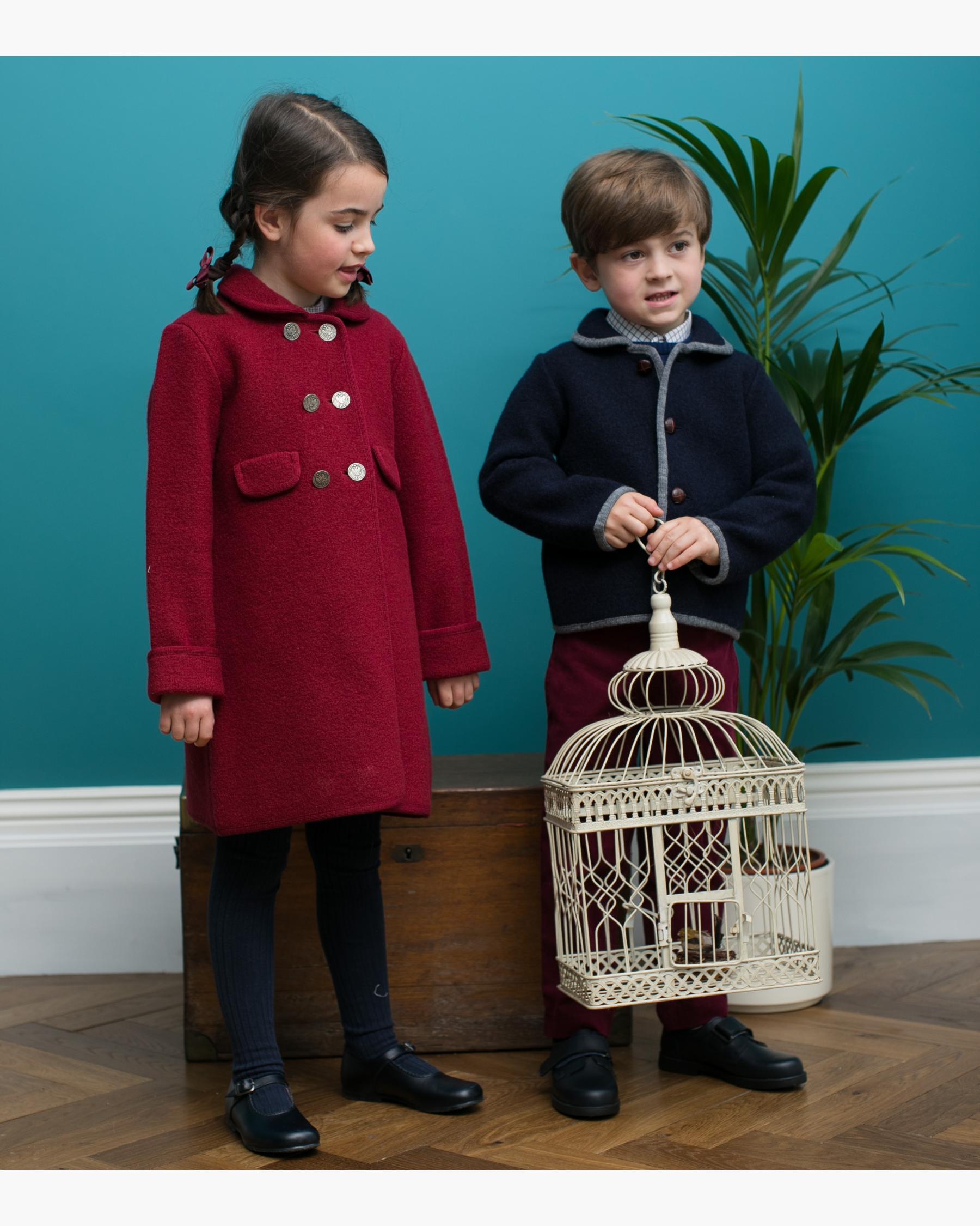 Girl and Boy wearing an Austrian Coat