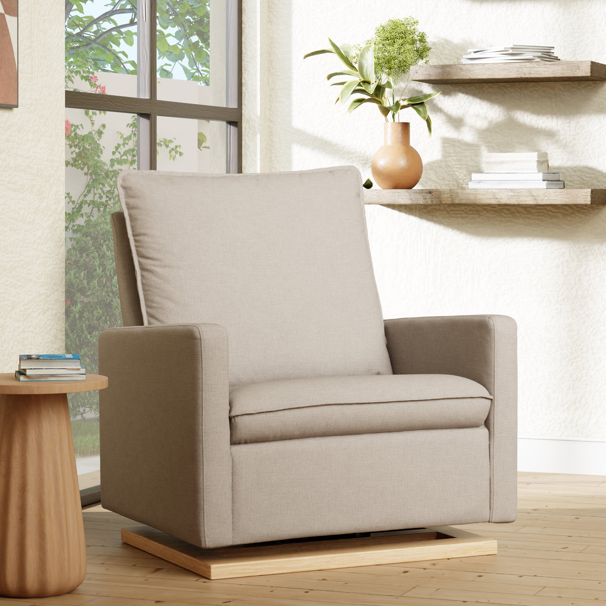 Three-quarter view of Cali Pillowback Chair and a Half Glider showcasing plush pillowback, wide seat, and light wood base