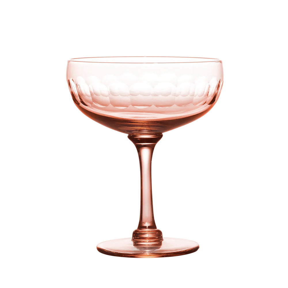 Front view of single rose cocktail coupe showing hand-engraved lens band and slender stem on white background