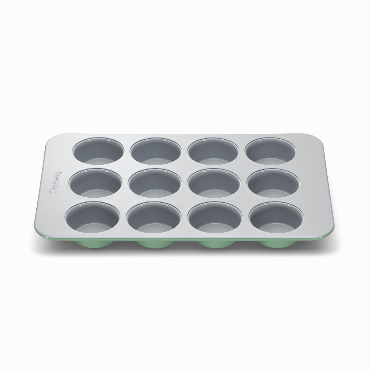 Low-angle front view of Caraway 12-cup muffin pan with non-toxic ceramic coating and sage underside