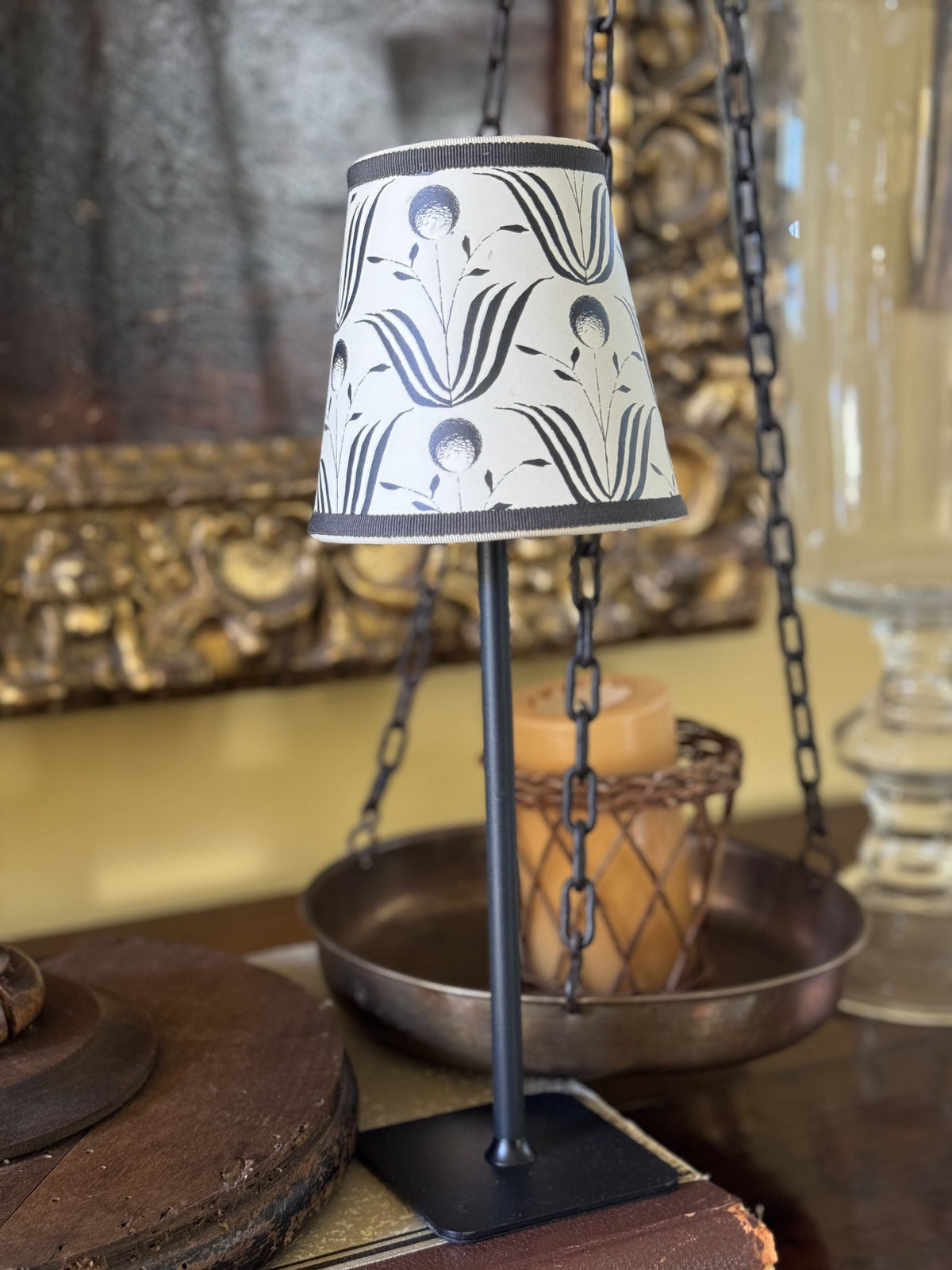 Front view of Mitchell Black Spring Bloom lampshade in shell white with black floral motif and grey trim on black stand