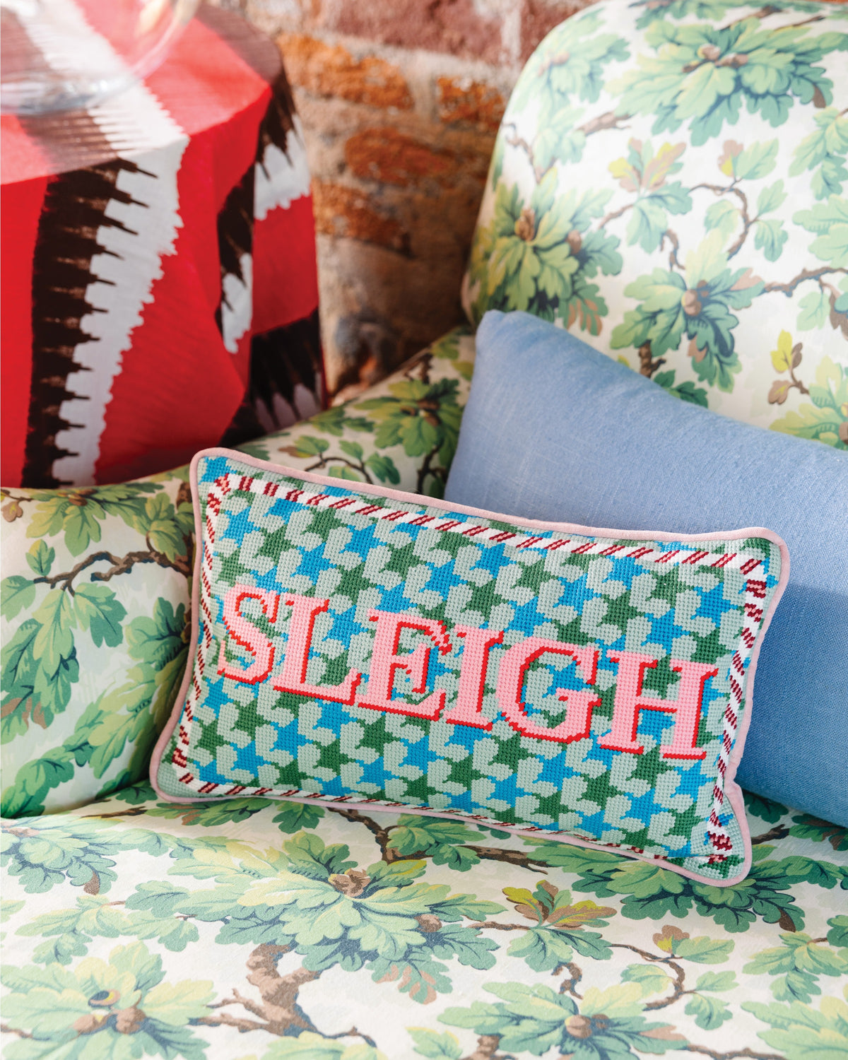 Sleigh Needlepoint Pillow - styled on sofa