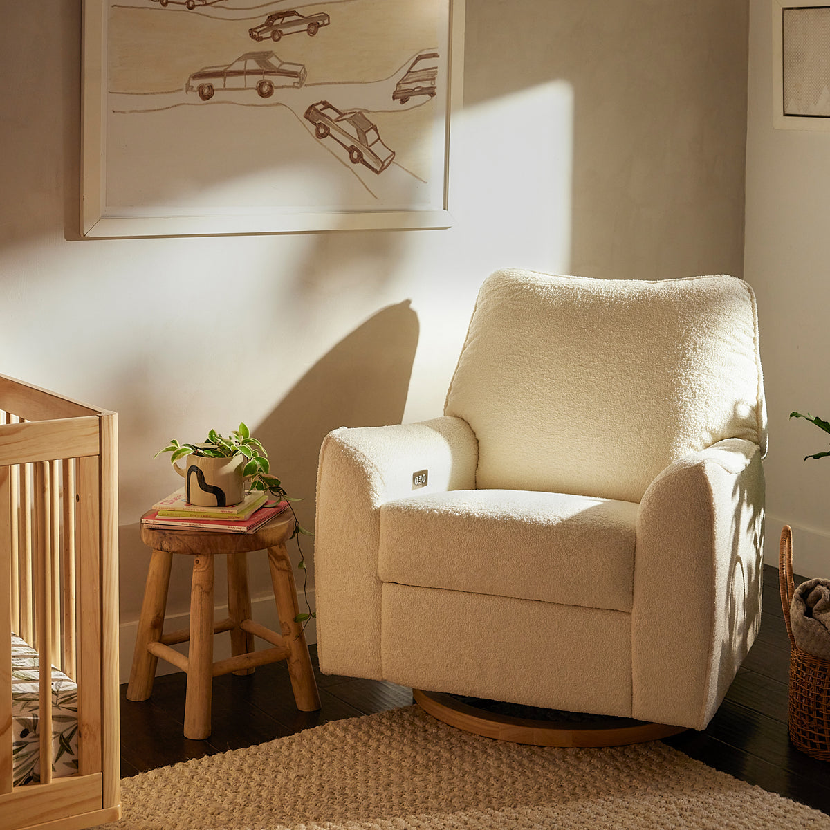 Three-quarter view of Sunday Power Recliner and Swivel Glider showcasing Chantilly fleece and light wood base in a nursery