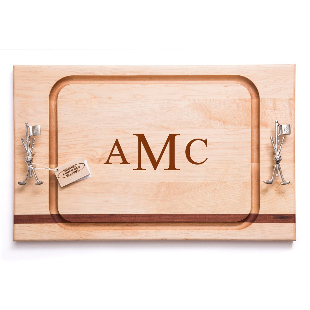 Top view of maple steak board with stainless steel golf club and flag handles, juice groove, engraved AMC monogram