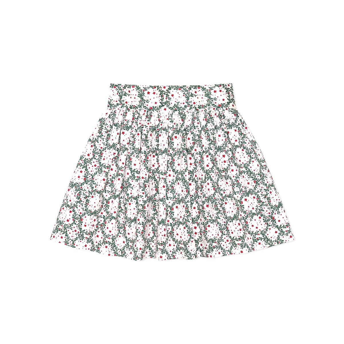 Girls’ Sutton Skirt in Regent Wreaths, featuring a festive green wreath and red star print on white with a full gathered silhouette.
