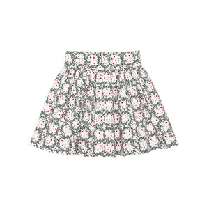Girls’ Sutton Skirt in Regent Wreaths, featuring a festive green wreath and red star print on white with a full gathered silhouette.