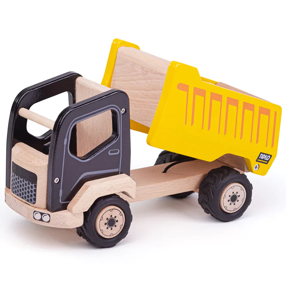 Three-quarter view of the Tipper Truck showcasing its raised working tipper bed and chunky rubber tires against a white background