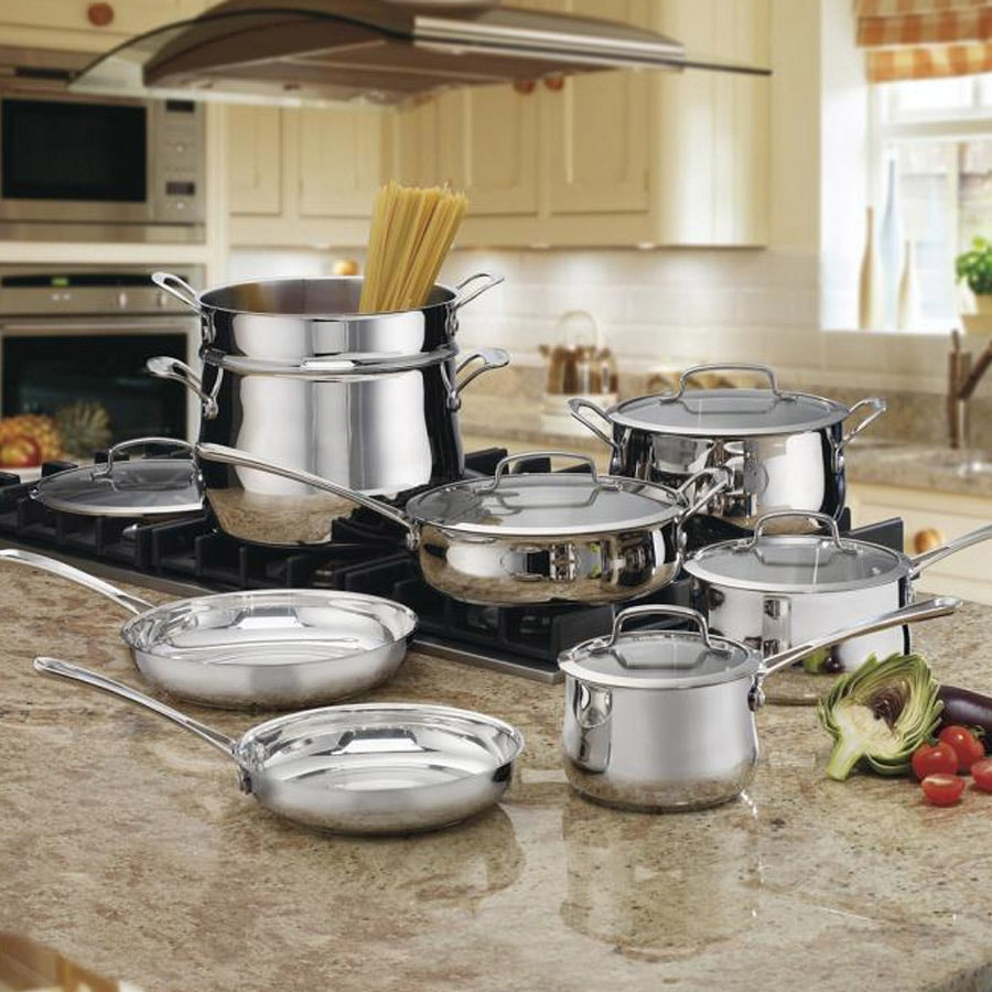 Front view of 13-piece Contour stainless cookware set showing stainless finish, glass lids and pasta insert on countertop