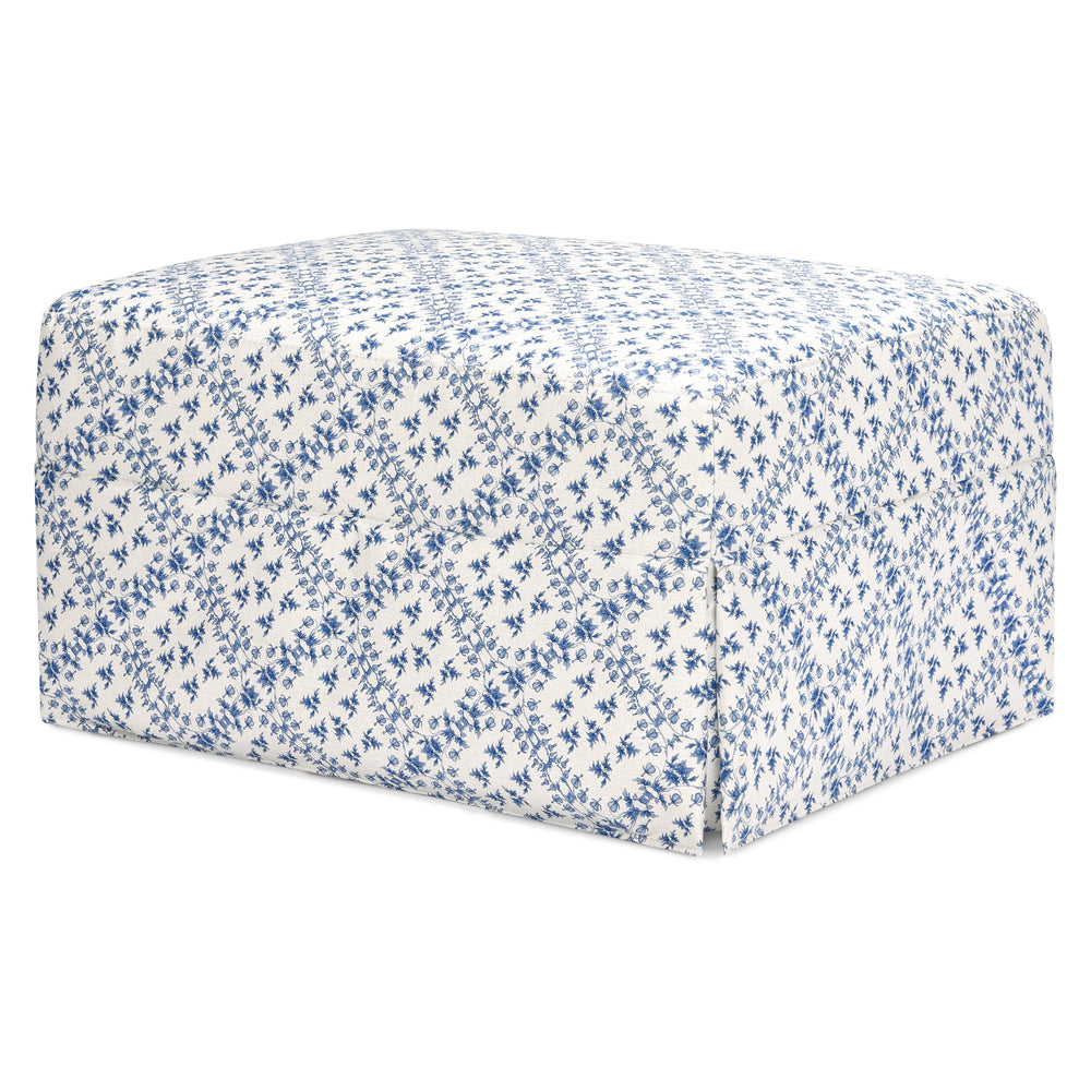 Three-quarter view of Crawford gliding ottoman in blue lattice performance eco-weave with skirted base on white background