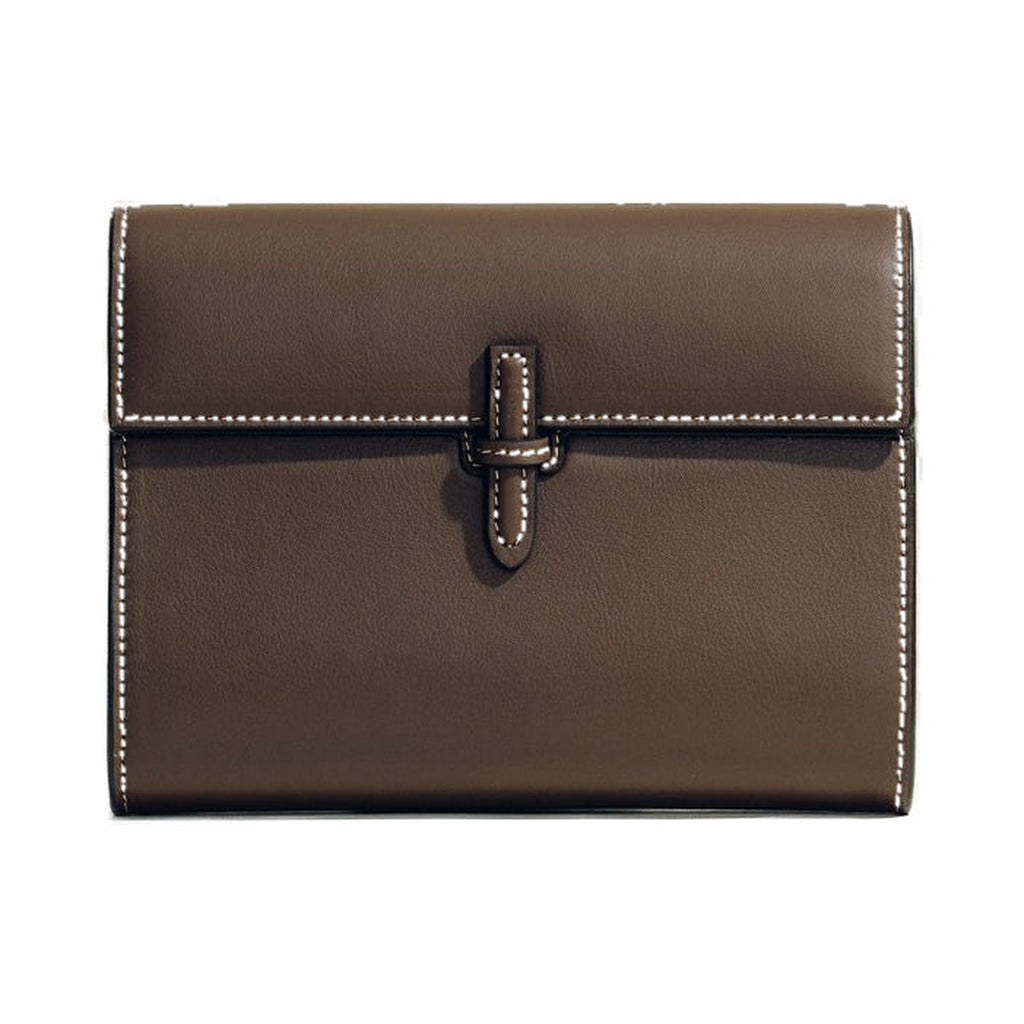 Front view of The Small Soft Clutch in Dark Brown Nappa showcasing its fold-over silhouette and signature slip-through closure on a white background