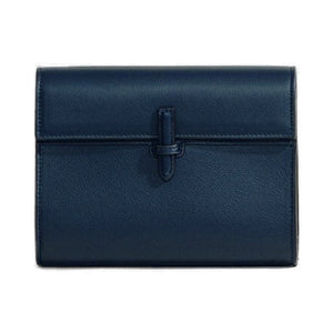 Front view of The Small Soft Clutch in Navy Nappa showcasing its fold-over silhouette and slip-through closure on a white background