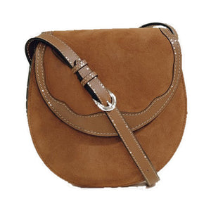 Front view of The Small Western Trim Saddle in cognac suede showcasing Nappa leather contrast trim and adjustable strap