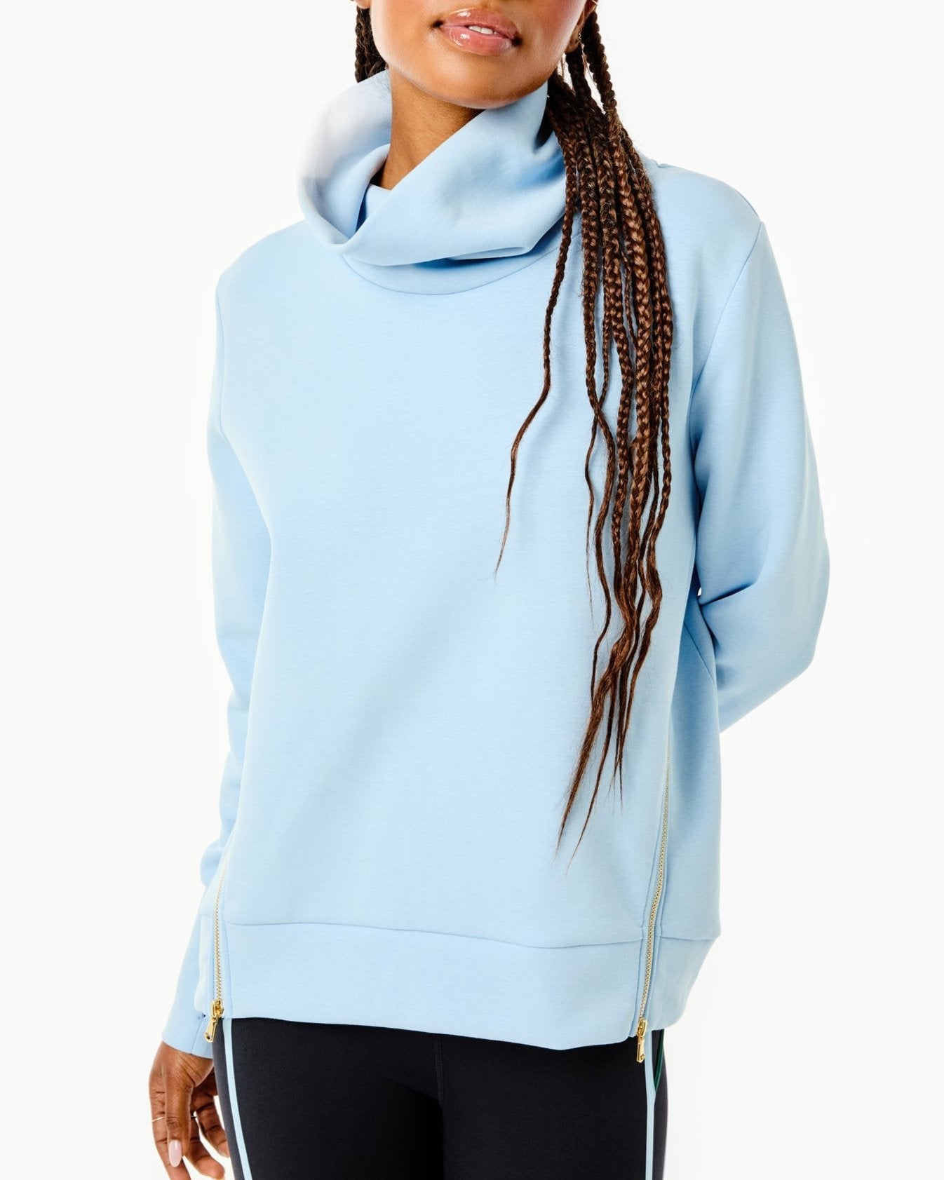 Model is wearing the Everyday Pullover in Baby Blue with the Chestnut Legging in Black