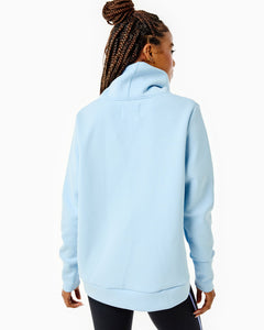 Model is wearing the Everyday Pullover in Baby Blue with the Chestnut Legging in Black