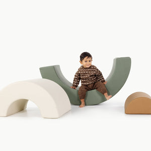 Thyme@kid playing on the thyme arc playset