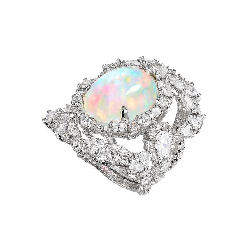 Angled view of three Sky Opal Ocean Rings with iridescent opal cabochon and gemstone-encrusted bands, white background